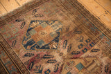 Worn vintage Malayer rug with simplified Herati motif in raspberry, sky blue, and gold tones.