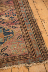 Reciprocating pawn border and aged Malayer rug with raspberry, sky blue, bronze tones.