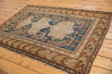 Antique Shirvan rug's Akstafa bird design, rich indigo blue field, and abrashed geometric borders.