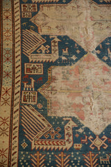Antique Shirvan rug detail: indigo Akstafa field with birds, geometric borders, and visible wear.