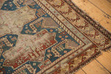 Antique Shirvan rug corner: Akstafa birds, geometric borders, indigo, rust hues, and visible wear.
