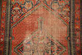 Extensive wear, exposed foundation on tomato red diamond medallion with reciprocating pawn borders.