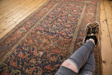 Visible madder root red border and interconnected floral patterns on an antique Bijar runner.