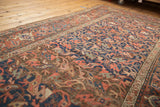 Antique Kurdish Bijar runner showing allover interconnected floral motifs in navy and madder root.