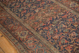 Kurdish Bijar interconnected floral pattern, madder root red, navy, oxidized green, showing mostly even wear.