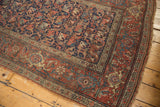 Antique Kurdish Bijar runner, madder red border with stylized floral patterns and low pile.
