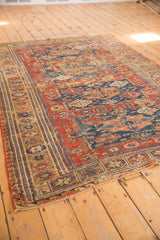 Late 19th century Soumac rug corner, showcasing reciprocating wave border and faded geometric motifs.