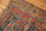 Antique Soumac carpet section showcasing the unique reciprocating wave border and stylized motifs.