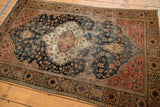 Antique Farahan Sarouk rug corner, classic main border, and worn field with color migration.