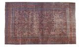 Vintage Meshed carpet with a dense floral and boteh pattern in cochineal red and navy blue.