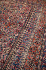 Rich cochineal red and navy blue floral patterns, scrolling designs, with even wear.