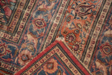 Folded vintage Meshed rug corner reveals worn ornate floral patterns and overcast perimeter.