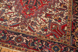 Vintage Heriz corner showing ivory field with serrated leaves, cherry red Samovar and navy borders.