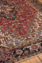 Reciprocating samovar and floral design motifs on a navy blue Heriz border.