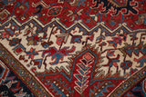 Vintage Heriz carpet with cherry red, ivory, sky blue geometric floral patterns.
