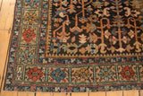 Traditional vintage Heriz carpet corner with unusual framed floral border.
