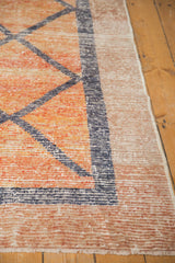Detail of distressed Oushak runner showing worn knot heads, raspberry abrash, and beige border.