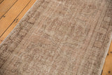 Distressed surface of vintage Oushak runner, showing even wear, tone-on-tone sand hues, and intact selvage.
