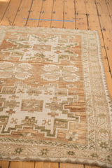 Distressed vintage Oushak rug with heavily abrashed field, coffee brown and ivory geometric motifs.