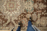 Vintage Distressed Sparta carpet texture with visible foundation, showing plum, teal, and beige palmettes.