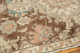 Sprawling palmette and leaf design with distressed texture on a vintage Sparta carpet section.