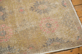 Worn pile texture of distressed Oushak rug, splayed floral motifs in ivory, beige, blush pink.