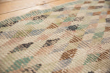 Distressed vintage Oushak rug runner, showcasing worn lattice diamond patterns and visible foundation texture.