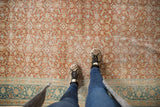 Distressed Sivas carpet field with terracotta, beige Herati motif, and teal border.