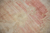 Low pile with heavily abrashed blush and ivory tones on a vintage Oushak rug.