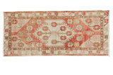 Distressed vintage Oushak runner, blush, rose, ivory, and gold oversized floral medallion.