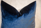 Close-up of the lustrous cobalt navy velvet throw pillow with soft folds.