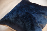 Cobalt navy luxe velvet throw pillow texture, showing its brass zipper detail.