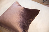 Velvety lavender plum fabric of the throw pillow, with linen backing and brass zipper.