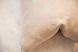 Textured natural linen backing in a light beige weave.