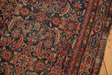 Close-up of the Hamadan runner's Herati pattern, showing deep navy, red, and foundation wear.