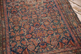Detailed Herati motif and Serbend border of a Hamadan runner with navy, red, green, and visible wear.