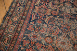 Vintage Hamadan rug runner with wear to knot heads and exposed foundation.