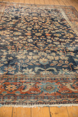Mahal carpet's terra cotta palmette border with sky blue and ivory motifs, showing low pile.