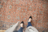 Distressed vintage Oushak rug, soft red, ivory, and denim blue allover floral vinery.