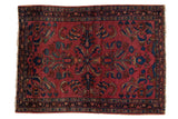 Hand-knotted Vintage Lilihan Persian rug with raspberry red field and floral medallion.