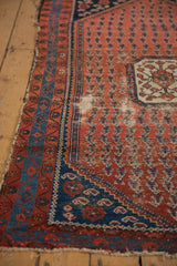 Antique Kurdish Hamadan rug's madder red boteh field, navy and sky blue borders, localized hard wear, tattered edge.