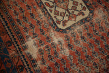 Antique Kurdish Hamadan rug, madder red field, navy boteh pattern, localized hard wear.