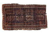 Antique Fragment Belouch rug, dark navy, madder red, brown double column medallions. Late 19th century.