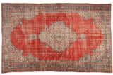 Vintage distressed Oushak carpet with European inspired medallion in cherry red, ivory, and mint.