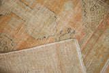 Distressed Oushak rug with even wear showing woven reverse and secured side.