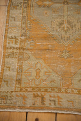 Original side cord selvage and worn geometric border of the distressed Oushak runner.