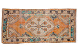 Vintage distressed Oushak runner with tangerine, ivory, turquoise hexagonal medallion and vine border.