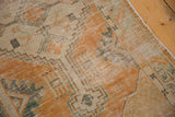 Distressed Oushak rug edge, pale tangerine, ivory, mint geometric design, intact selvage.