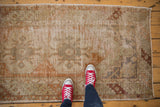 Distressed vintage Oushak runner showcasing mostly even wear to foundation and faded colors.