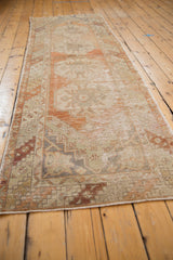 Vintage Distressed Oushak runner, showing mostly even wear in blush, terra cotta, and ivory.